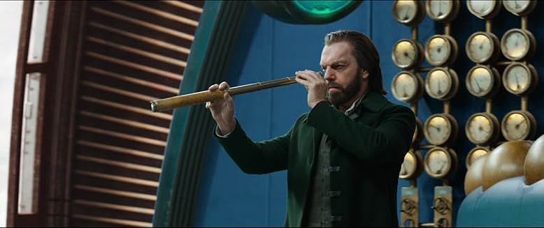 緑色のコートを着て、冷酷な野望を語るヴァレンタイン